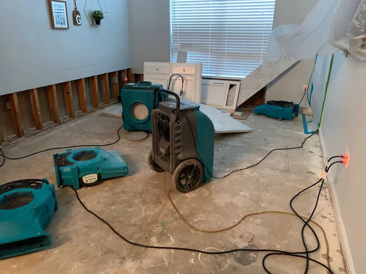 Dehumidifier in flood-cut room for Water Damage Restoration in Briar Chapel